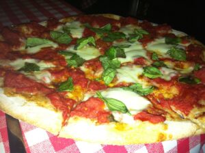 A SLICE OF ITALY: A margherita pizza from Sylvia's Brick Oven topped with fresh Monzerella and whole basil leaves.  A signature pizza is $13 and feeds two.